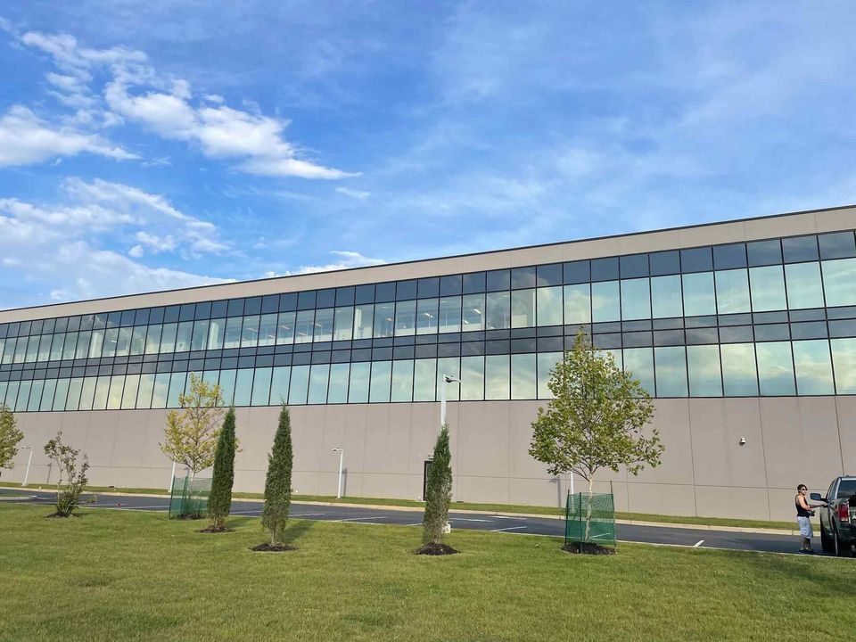 Commercial window tinting installed on modern office building glass facade